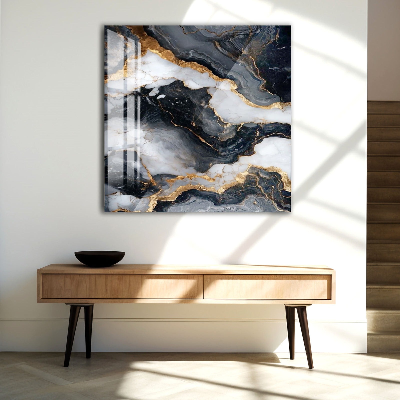 a modern interior design with a large abstract painting hanging on the wall above a wooden console table.