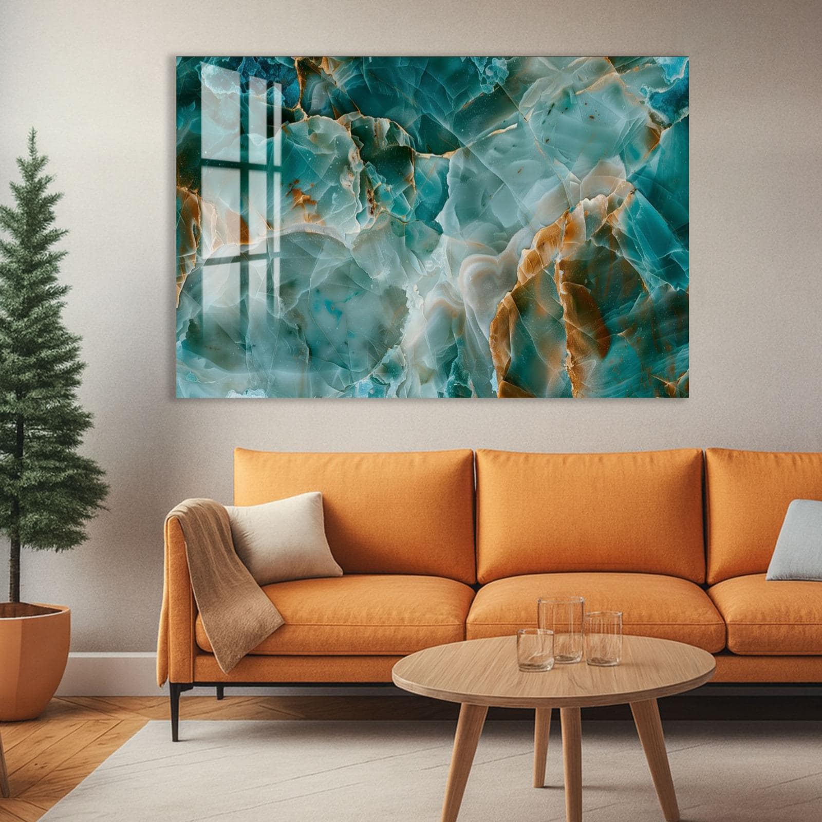 a modern living room with a large abstract painting hanging on the wall above a cozy orange sofa. The sofa is positioned in front of a coffee table, which has a few glasses on it. The room also includes a potted plant and a wooden floor, creating a warm and inviting atmosphere.