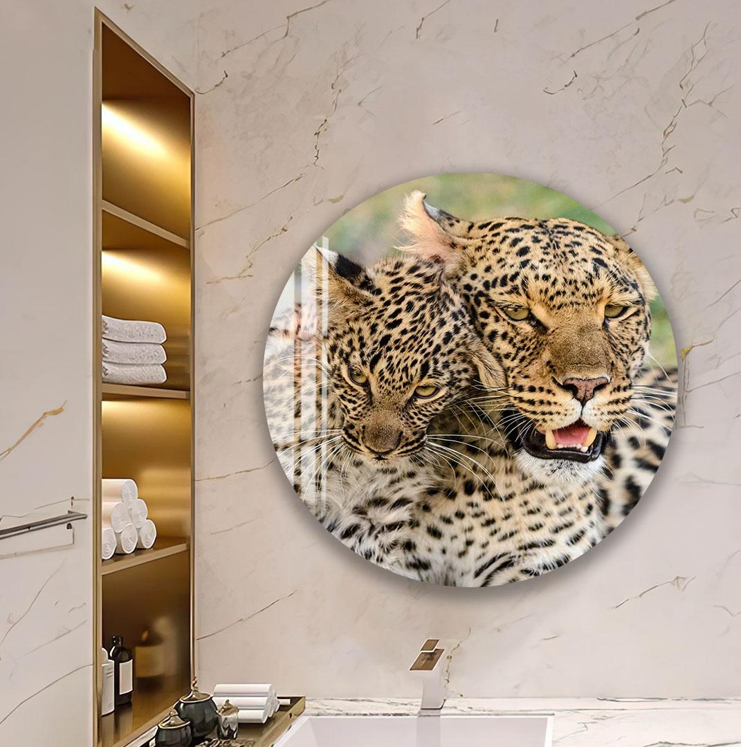 a large, round, black and white tiger portrait displayed on a wall in a bathroom setting.