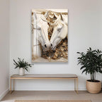 a large, ornate, and intricately designed sculpture of two horses, with a floral design surrounding them. The sculpture is mounted on a wall above a wooden bench, which is positioned in front of a potted plant.