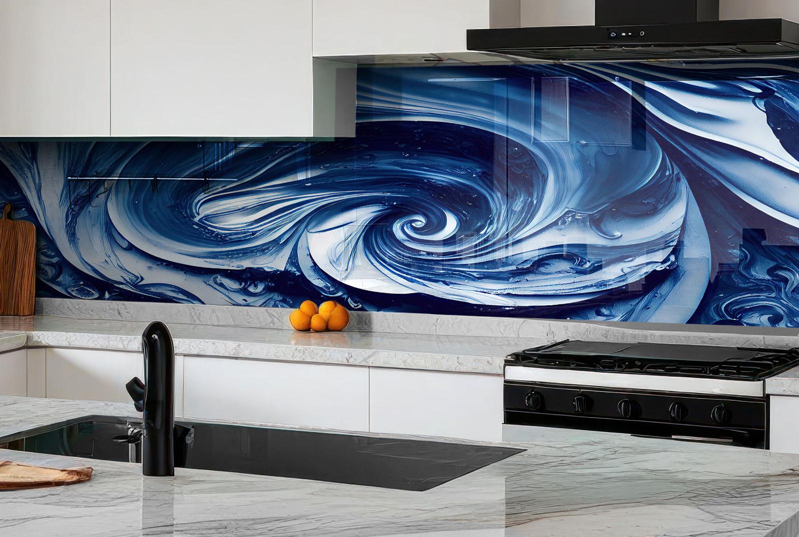 a modern kitchen with a striking blue and white abstract design on the backsplash behind the countertop. The kitchen is equipped with a gas range, a sink, and a wooden cutting board. There are also some oranges placed on the countertop.