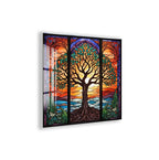 A vibrant stained glass artwork depicting a tree with intricate patterns and designs, set against a colorful sunset landscape.