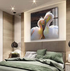 a large, colorful painting of two pelicans on a wall above a bed with a green comforter.