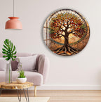 a living room with a large circular wall art depicting a tree with a stained glass design. The room has a pink lamp, a gray sofa, and a wooden coffee table.