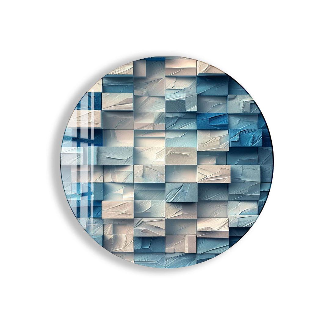 The image is a circular, abstract artwork composed of various shades of blue and white geometric shapes, creating a visually striking and intricate design.