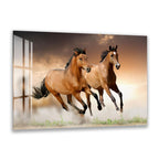 A close-up image of two leopards, one adult and one juvenile, resting together in a natural setting.