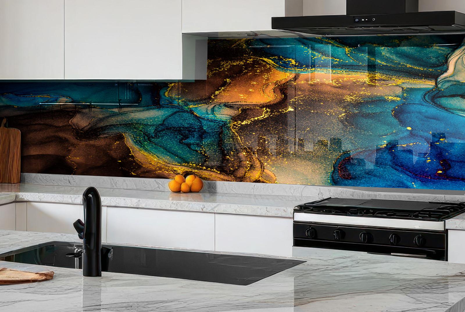 a modern kitchen with a striking backsplash that showcases a vibrant abstract design in shades of blue, orange, and brown. The kitchen is equipped with a gas range and a sink, and there are a few oranges placed on the countertop.