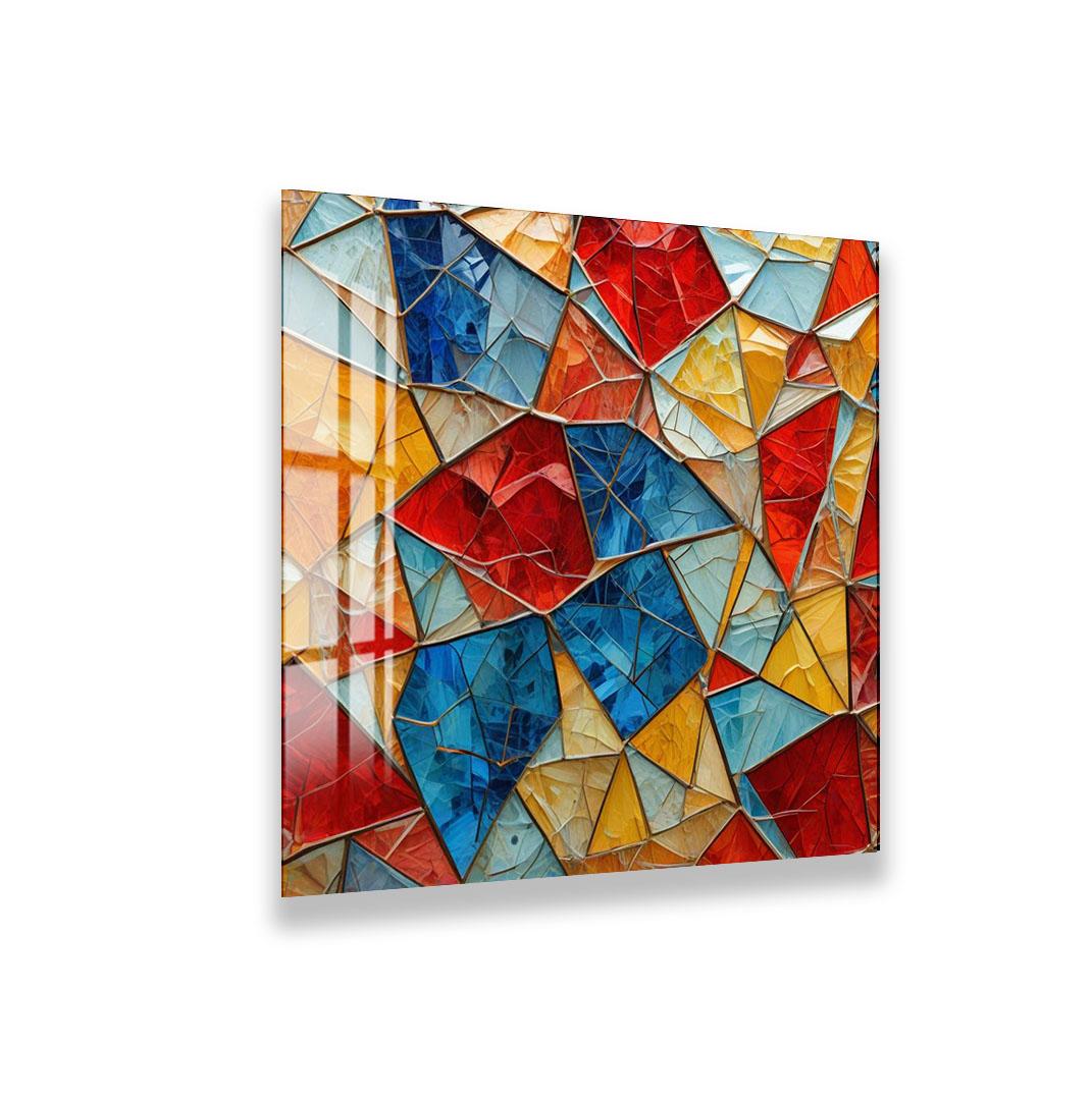 The image is a vibrant and colorful abstract mosaic composed of various geometric shapes and patterns in red, blue, yellow, and orange.