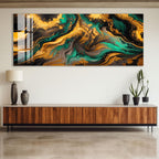 a large abstract painting with swirling patterns of green, black, and gold colors, hanging on a wall above a wooden cabinet. The cabinet has a sleek, modern design with a dark finish. On the cabinet, there are two black vases and two potted plants, adding a touch of greenery to the space.