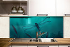 a kitchen with a sink and a dragon in the water