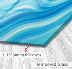 a blue and white painting on a wooden floor