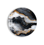 a marble-like design with a striking black and white color scheme, accented by gold elements. The design appears to be a round, oval-shaped piece, possibly a wall hanging or a decorative item.