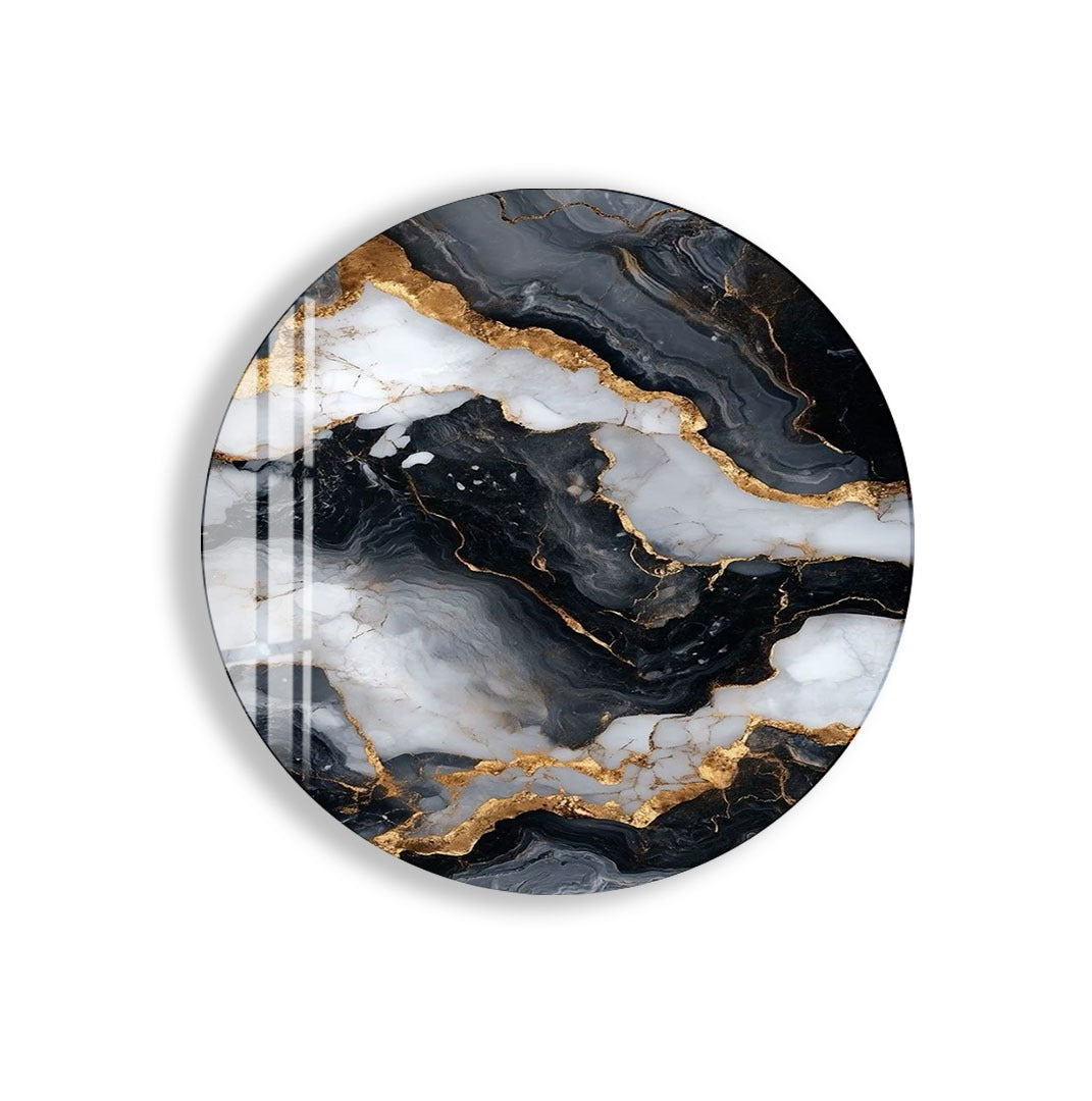 a marble-like design with a striking black and white color scheme, accented by gold elements. The design appears to be a round, oval-shaped piece, possibly a wall hanging or a decorative item.