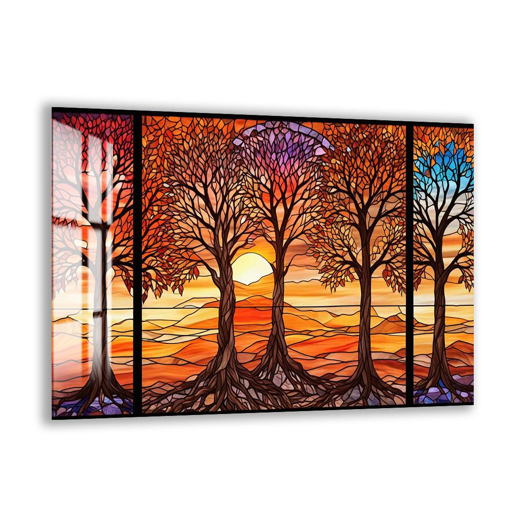 A vibrant stained glass artwork depicting a serene landscape with trees and a sunset.