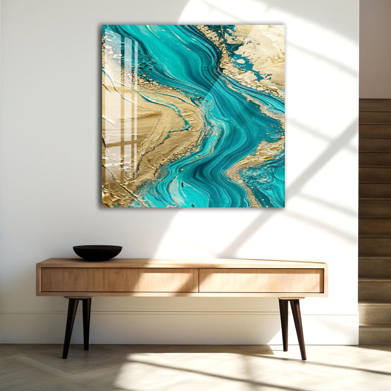 a large abstract painting with turquoise and gold colors, hanging on a white wall above a wooden console table.