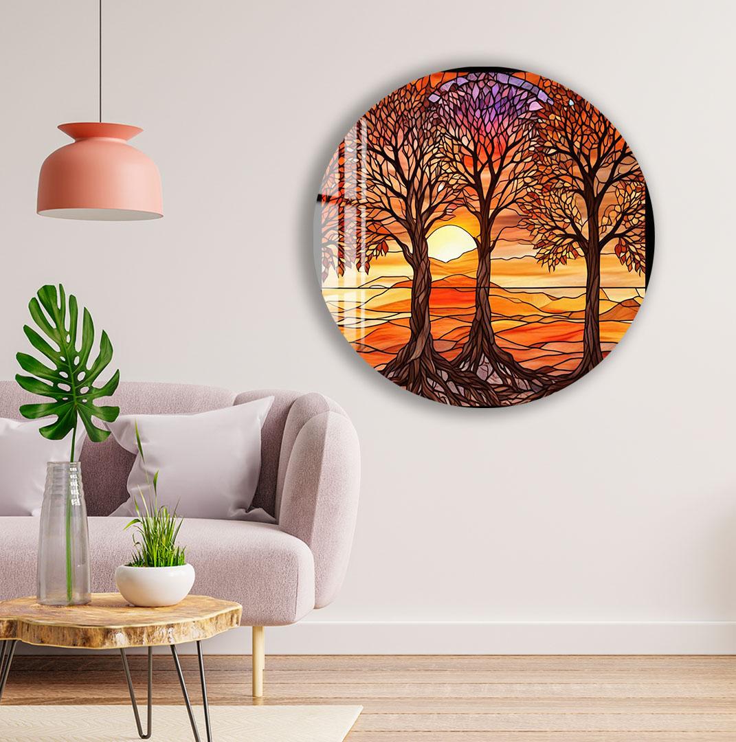 a living room with a round wall art depicting a sunset scene with trees and a palm tree. The room has a pink pendant light, a gray sofa, and a wooden coffee table.