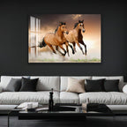 A large framed photograph of two leopards is displayed on the wall above a white sofa in a living room setting.