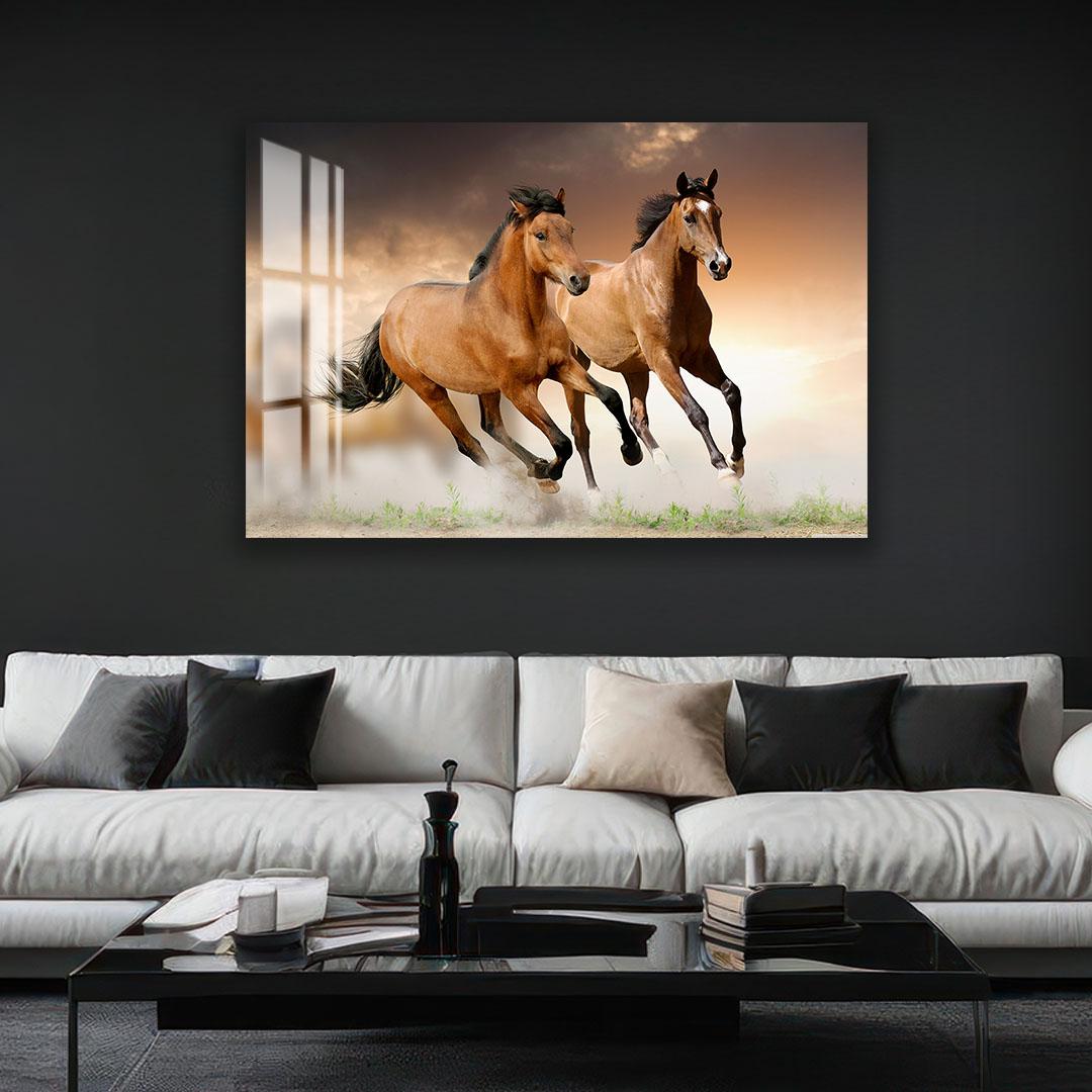 A large framed photograph of two leopards is displayed on the wall above a white sofa in a living room setting.