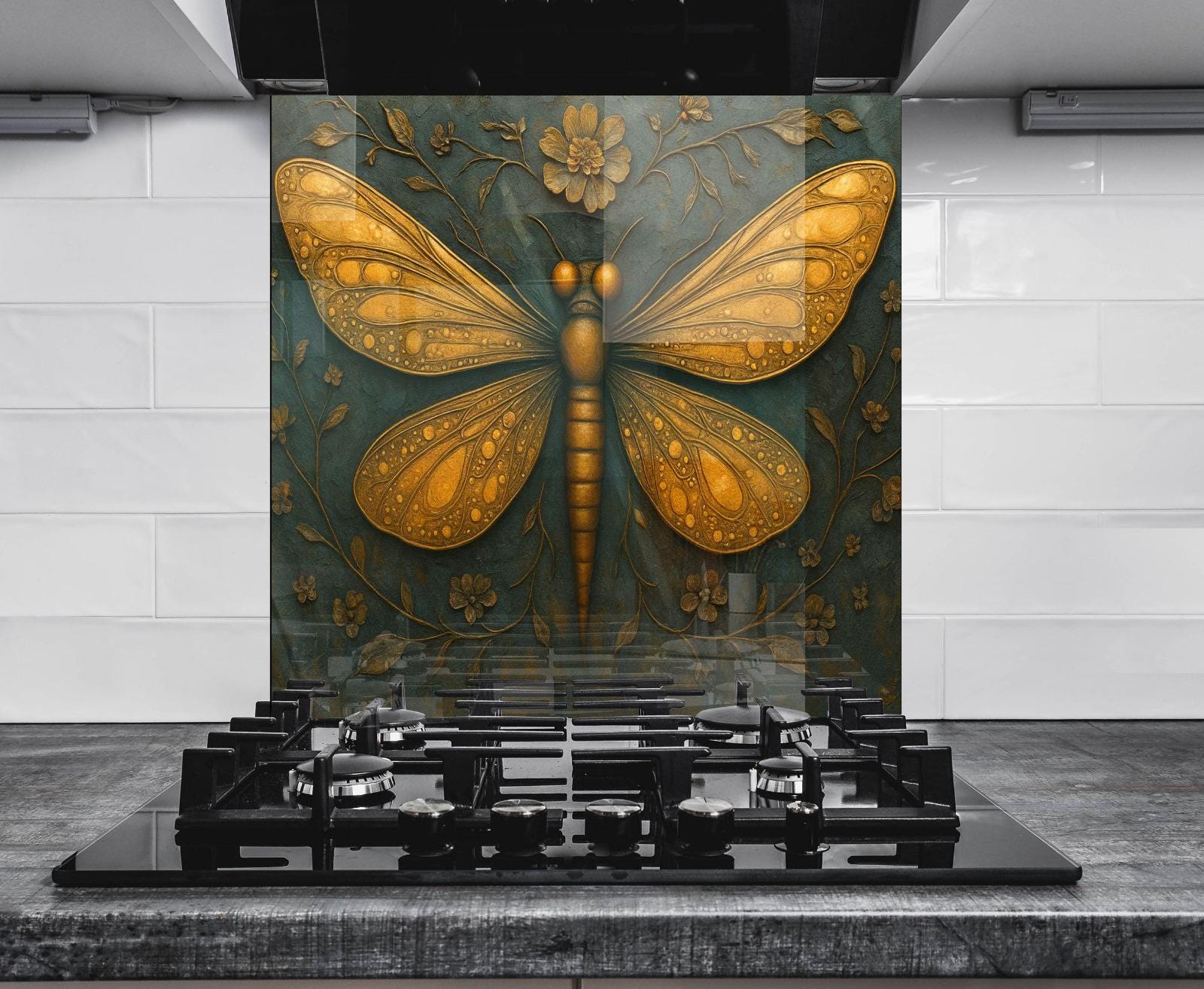 a large, ornate butterfly design on a wall behind a gas stove.