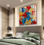 a modern bedroom with a large, colorful abstract painting hanging on the wall above a bed with green bedding.
