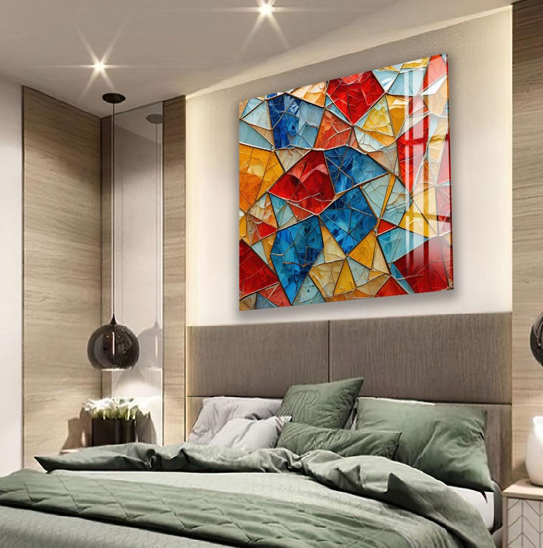 a modern bedroom with a large, colorful abstract painting hanging on the wall above a bed with green bedding.