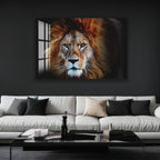 a large, framed photograph of a majestic lion's face on the wall above a modern, black coffee table in a living room setting.