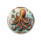 a large, detailed painting of an orange octopus with its tentacles spread out, creating a striking and intricate visual.