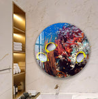 a bathroom with a large round wall art depicting a vibrant underwater scene with colorful fish swimming among coral and other marine life.