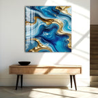 a large abstract painting hanging on a white wall above a wooden console table.