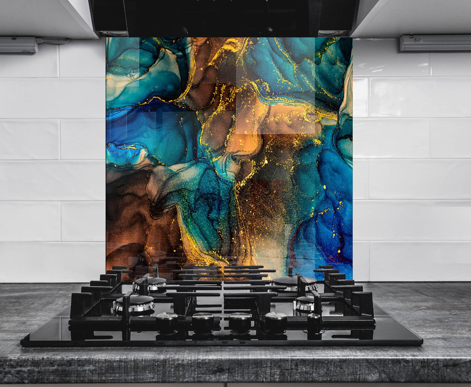 a modern kitchen with a striking backsplash that showcases a vibrant abstract design in shades of blue, gold, and brown. The backsplash is positioned above a gas stove, creating a visually appealing contrast between the functional and artistic elements of the space.