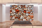 Rustic stone wall pattern printed on glass backsplash.