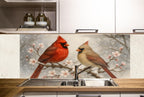 a kitchen sink with a painting of two cardinals on it
