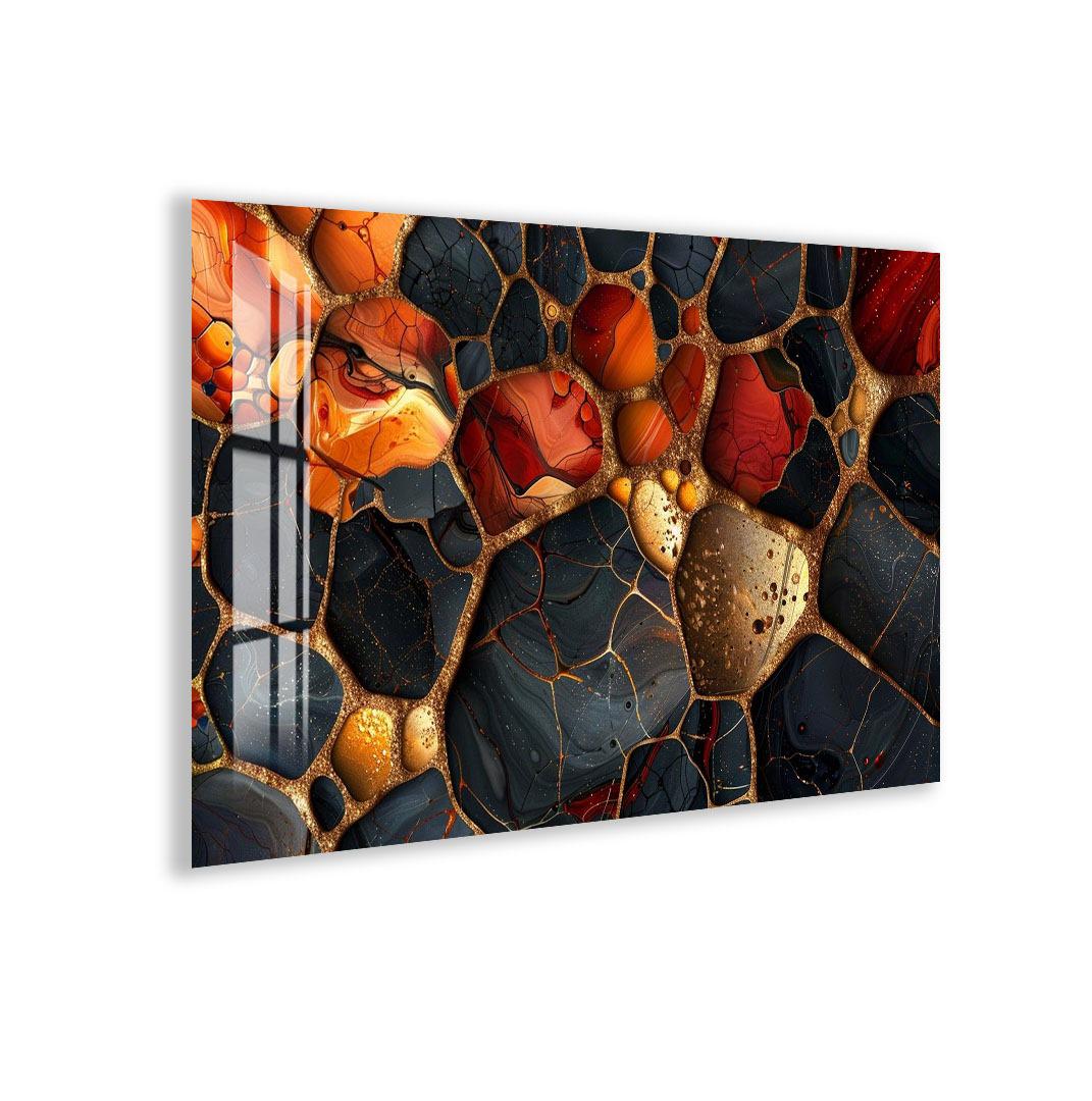 The image is a vibrant and colorful abstract artwork featuring a variety of shapes and textures, including circles, rectangles, and other geometric forms. The colors used are predominantly orange, black, and gold, creating a visually striking and dynamic composition.