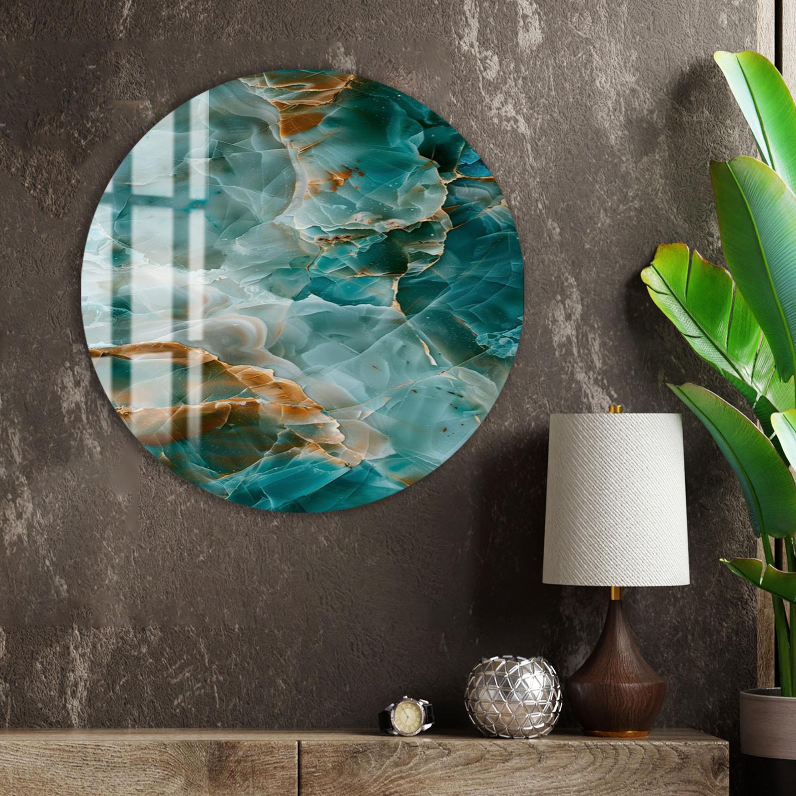 a large circular wall art piece with a vibrant abstract design of blue, green, and orange colors, hanging on a textured gray wall. The art piece is positioned above a wooden shelf with a lamp, a clock, and a small silver ball.