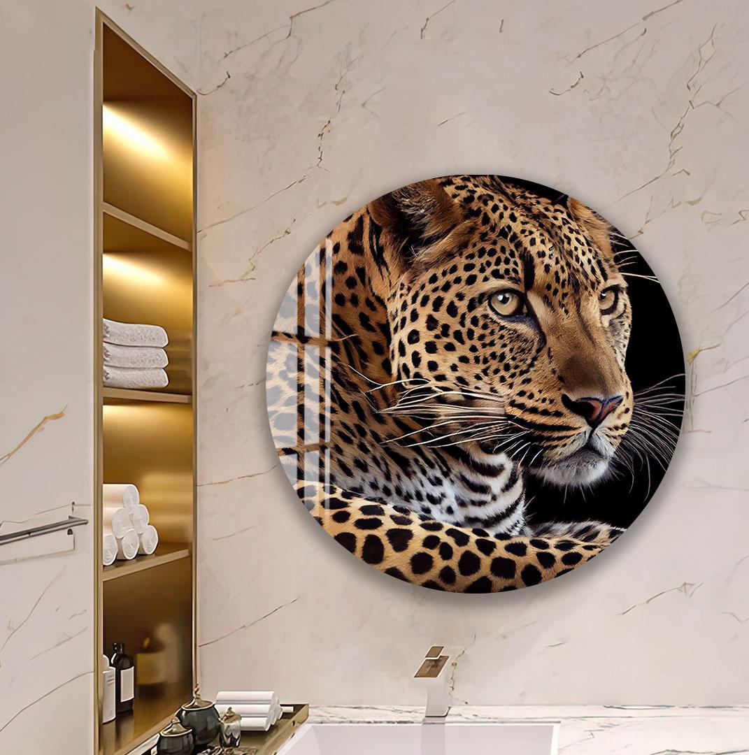 a large, round, and glossy wall decal depicting a close-up of a leopard's face.
