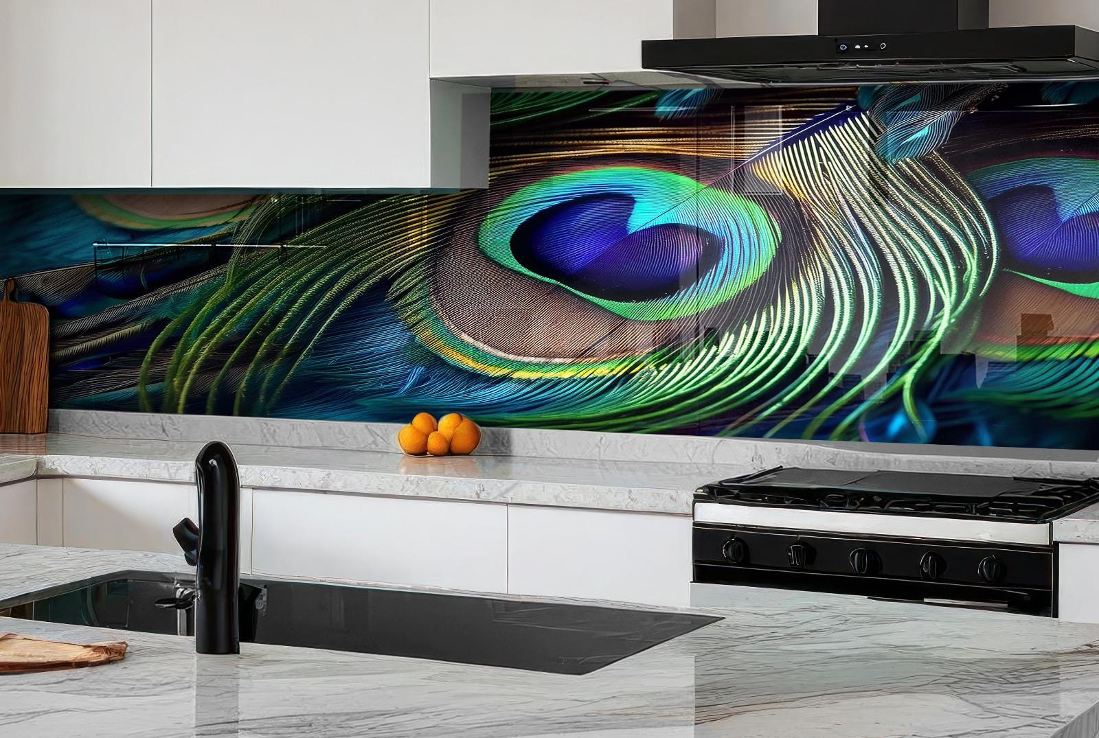 a modern kitchen with a large, colorful backsplash that showcases a close-up of a peacock feather. The kitchen is equipped with a gas range, sink, and various kitchen accessories, including a wooden cutting board and a bowl of oranges.