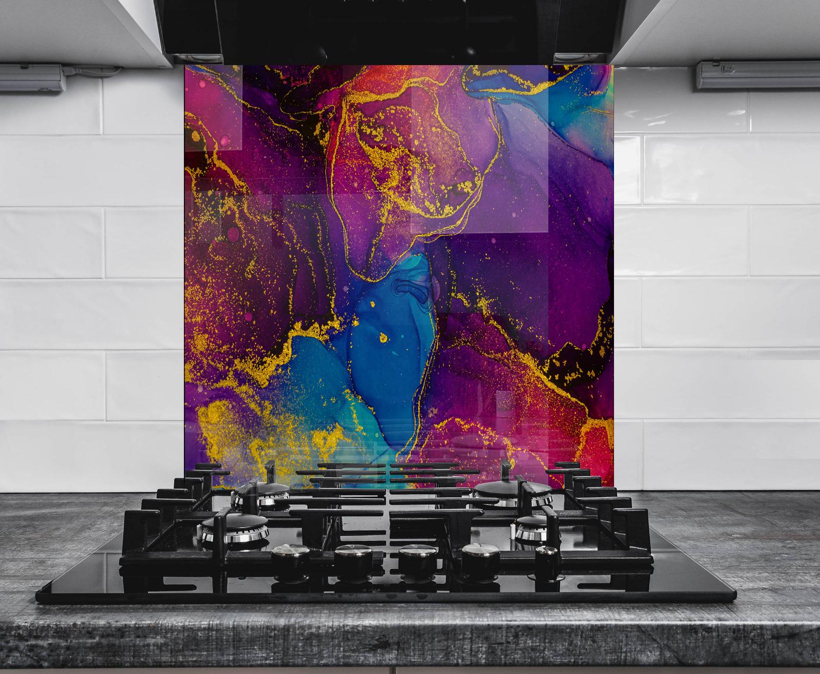 a modern kitchen with a striking abstract wall design in vibrant colors, including shades of purple, blue, and yellow. The design appears to be a large, colorful mural or painting, which serves as a focal point in the kitchen. In the foreground, there is a gas stove with black burners and knobs, adding a functional element to the space. The overall composition of the image is visually appealing and creates a sense of energy and creativity.