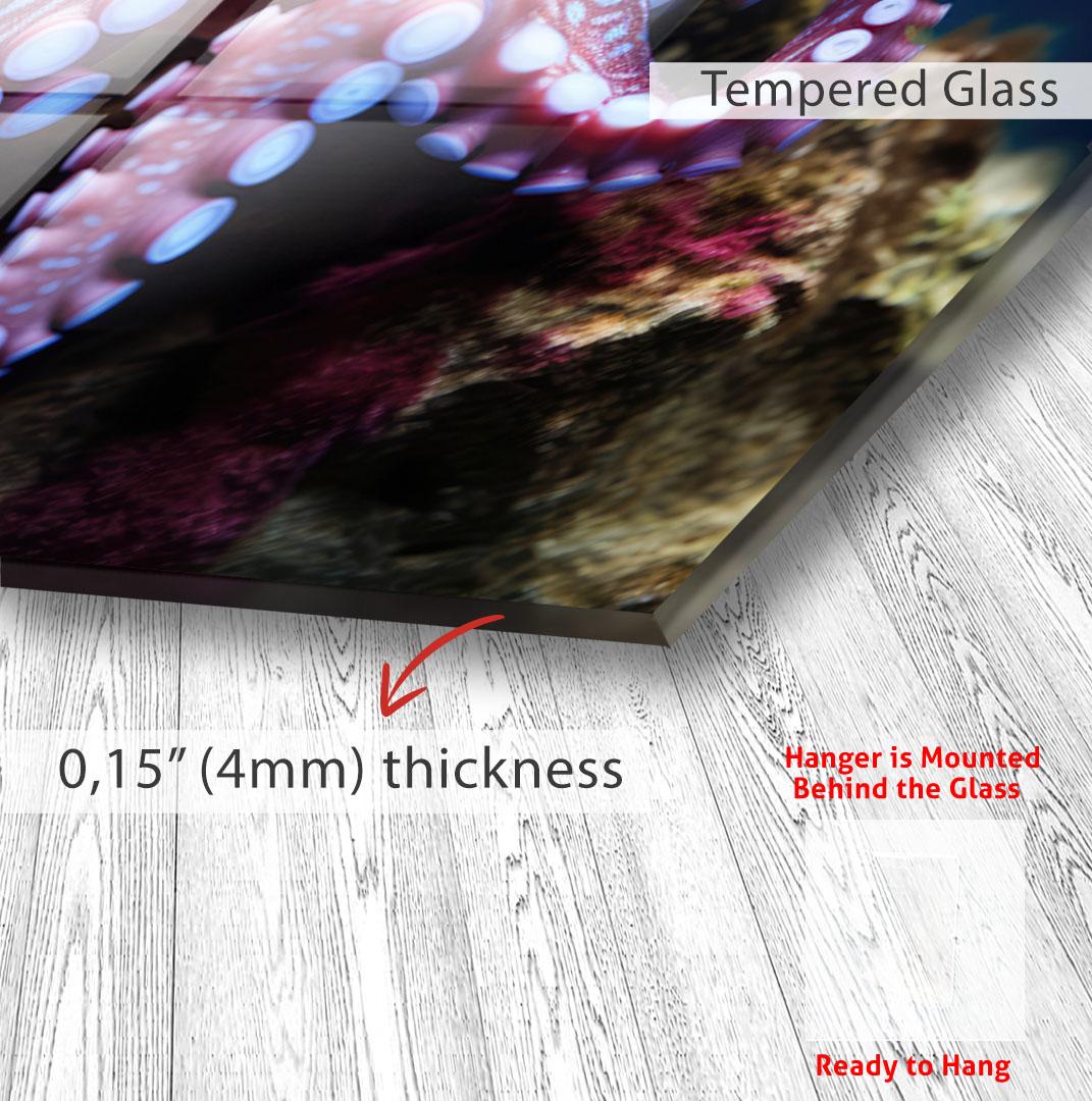 The image is a close-up of a glass surface with a text overlay indicating the glass is "Tempered Glass" and has a "0.15" (4mm) thickness. The text also mentions that the "Hanger is Mounted Behind the Glass" and is "Ready to Hang".