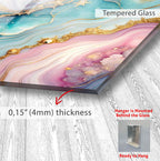 The image is a close-up of a Tempered Glass artwork, featuring a vibrant abstract design with swirling patterns in shades of pink, blue, and gold. The artwork is mounted on a wooden surface, and the image includes text providing information about the artwork, such as its thickness and the fact that it is mounted behind the glass.