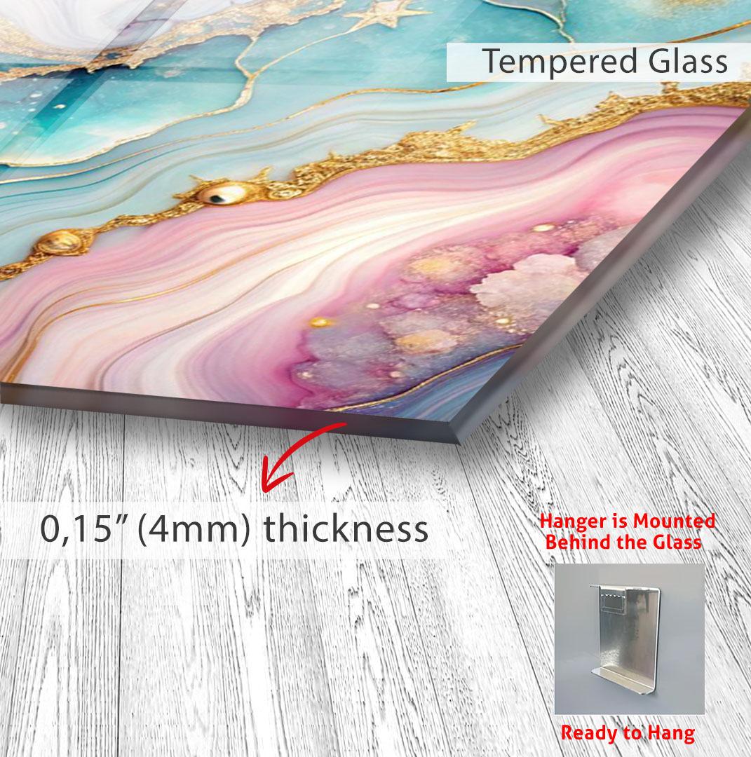 The image is a close-up of a Tempered Glass artwork, featuring a vibrant abstract design with swirling patterns in shades of pink, blue, and gold. The artwork is mounted on a wooden surface, and the image includes text providing information about the artwork, such as its thickness and the fact that it is mounted behind the glass.