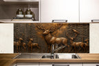 a kitchen with a sink and a metal deer wall mural