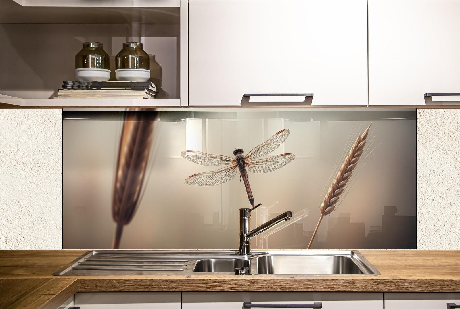 a kitchen with a sink and a dragonfly on the wall