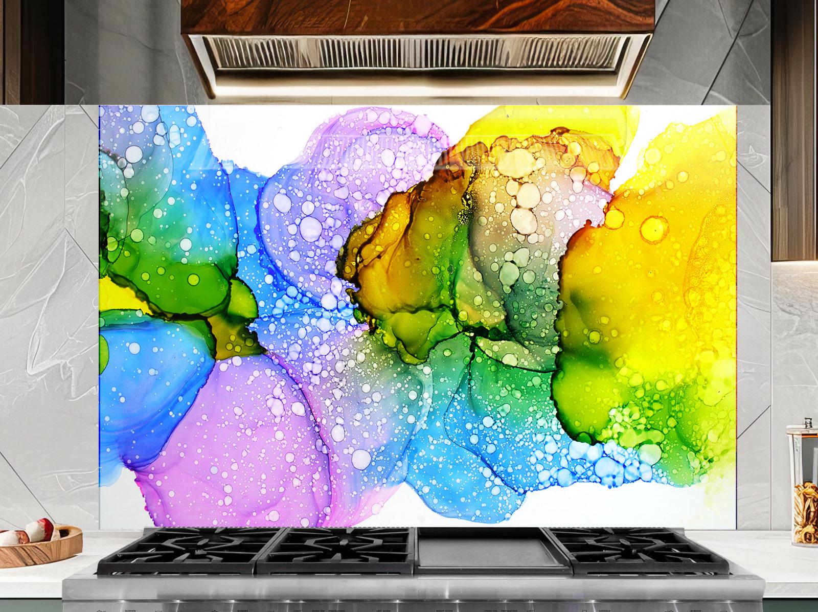 a vibrant abstract painting with a colorful, swirling design of bubbles and shapes in various shades of green, blue, yellow, and purple. The painting is displayed on a wall above a stovetop with a black oven hood.