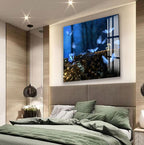 a large tiger in a glass enclosure, with its head submerged in water, creating a striking visual effect.