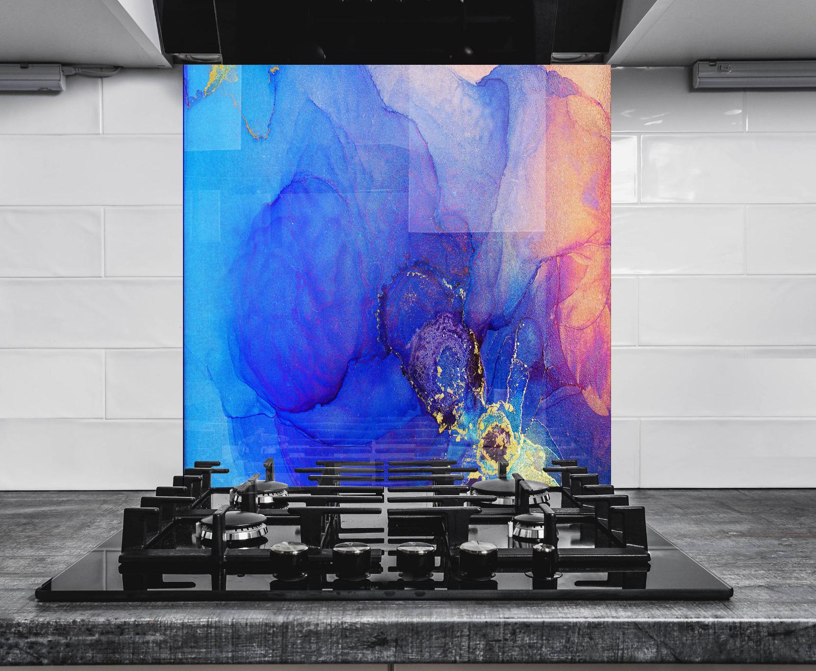 a modern kitchen with a gas stove and a large abstract painting on the wall behind it.