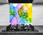 a vibrant abstract painting of colorful bubbles and shapes on a wall, with a gas stove in the foreground.