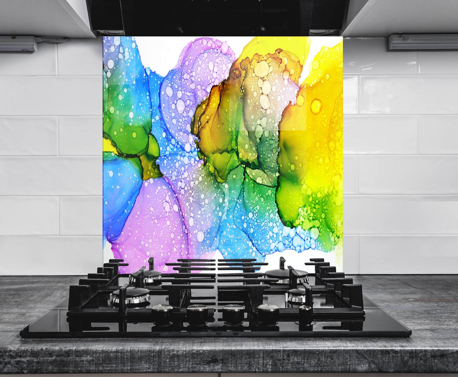 a vibrant abstract painting of colorful bubbles and shapes on a wall, with a gas stove in the foreground.