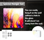 The image is a special hanger set that allows you to easily hang it on the wall without a hole in the glass. It will stand 1 cm away from the wall.