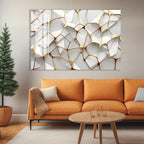 a modern living room with a large abstract art piece hanging on the wall above a cozy orange sofa. The sofa is positioned in front of a coffee table, which has a few empty glasses on it. The room also includes a potted plant and a wooden floor, creating a warm and inviting atmosphere.