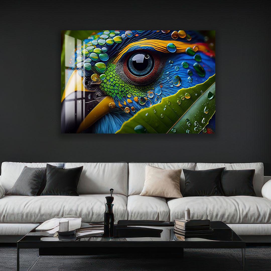 a large, colorful painting of a bird's eye on a wall above a white couch in a living room setting.